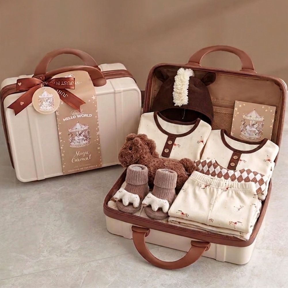 Horse inspired Baby outfit set with clothes, shoes, and a toy in a suitcase on a neutral background